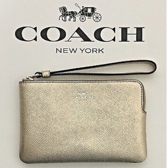 Coach Handbags - Gold Metallic Coach Wristlet